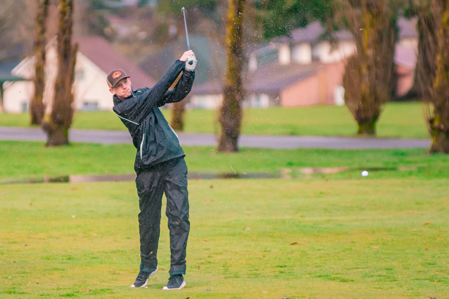 FILE PHOTO: A ball zooms through the air as W.F. West’s Evan Tornow swings his club at the Newaukum Valley Golf Course earlier this season.